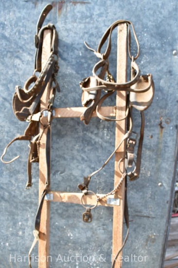 2 Bridles with twisted snaffle bits and blinders