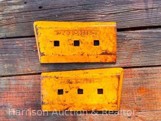 Two yellow hot cupped and dozer blades
