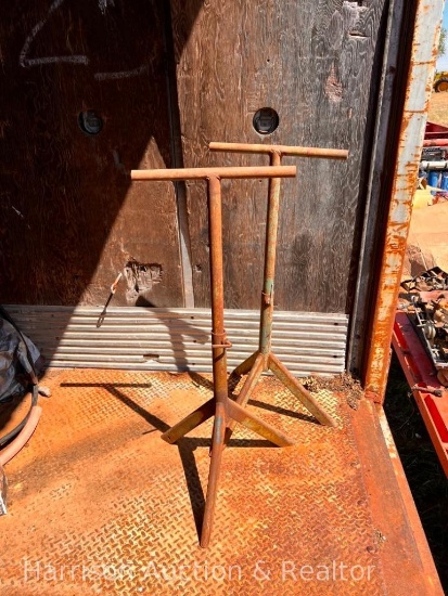 Two metal sawhorse tripods