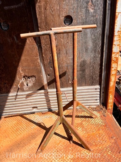 Two metal sawhorse tripods