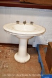 White oval pedestal sink