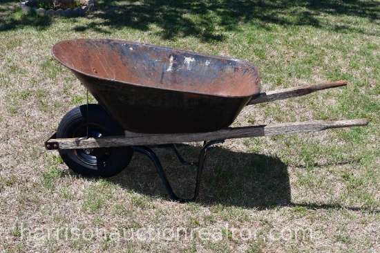 Metal wheel barrel with wooden handles