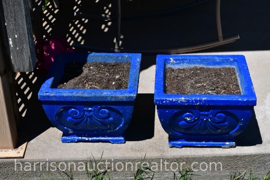 two blue concrete planters