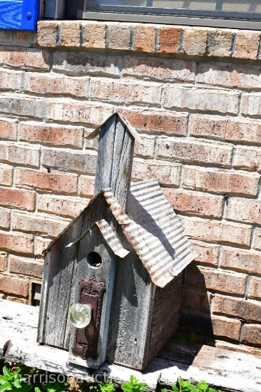 handmade birdhouse with tin roof and vintage glass door knob