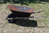 Metal wheel barrel with wooden handles