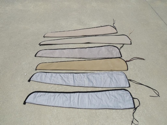 Six soft slip on gun cases.