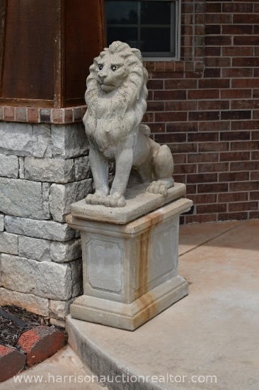 Outdoor garden lion statuary on pedestal