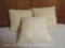 Set of three, off white, lace covered throw pillows.