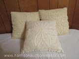 Set of three, off white, lace covered throw pillows.