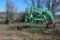 Farmhand Quick attach loader with spikes