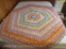 Vintage hexagon shaped quilted table topper.