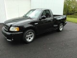 2000 Ford Lightning Pick-Up Truck.38k actual miles as stated on title.Black