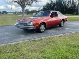 1976 Chevy Monza. 2.3L engine. Odometer reads 36,613. Bucket seats with con