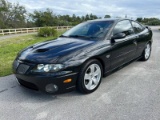 2005 Pontiac GTO Coupe. 6.0L V8 engine. Gasoline. Rear wheel drive.Black on