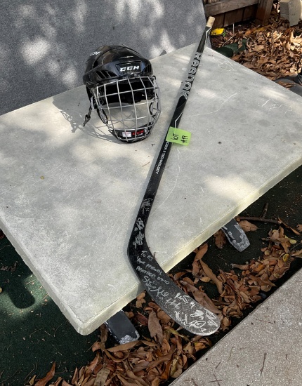 Autographed Hockey Stick by Florida Panthers 2010 national team and helmet