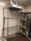 4 tier stainless rack with miscellaneous items