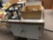 White maintenance utility cart with miscellaneous items