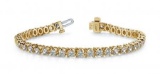 14K YELLOW GOLD .75 CTW G-H I1/I2 PRONG SET DIAMOND STRAND TENNIS BRACELET