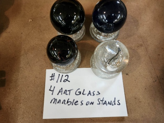 4 ART GLASS MARBLES ON STANDS LOT