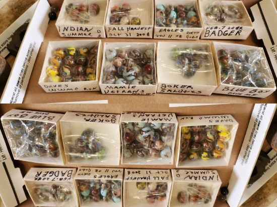 12 SMALL BOXES OF MARKED MARBLES