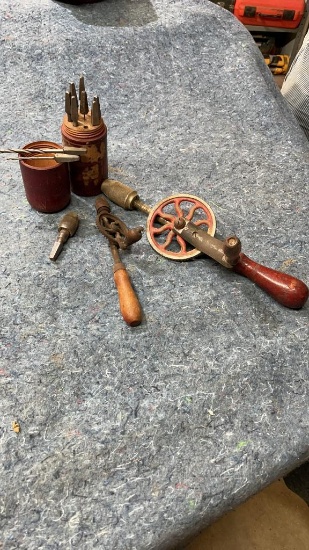 Vintage hand drills with bits and organizers