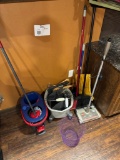 lot of mops/brooms/sweeper