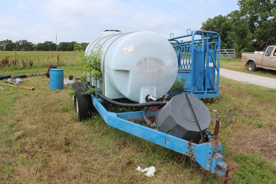1,000-gallon poly tank on a tandem axle trailer