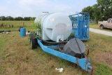 1,000-gallon poly tank on a tandem axle trailer
