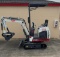 Track hoe with thumb bucket and ROPS