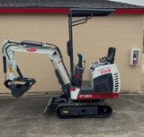 Track hoe with thumb bucket and ROPS