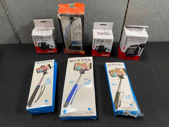 Lot of Smartphone Holders and Extendable Selfie Sticks