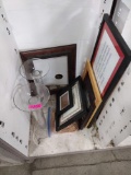 Various picture frames, drapes, and glass decor