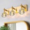 OSGNER Bathroom Light Fixtures, Vanity Lights Gold Bathroom Lights Over Mirror 3 Light Crystal Brass
