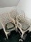 Threee vintage white chairs with cushions