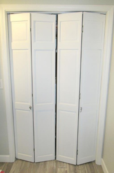 Pair Of White Bi-Fold Closet Doors