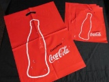 (1) Large Coca-Cola Plastic Shopping Bag And (4) Small Coca-Cola Plastic Shopping Bags
