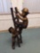 R1- Bronze Statue of Children Playing As Firemen on Ladder.