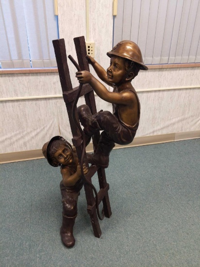 R1- Bronze Statue of Children Playing As Firemen on Ladder.