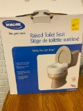 New in Box Raised Toilet Seat
