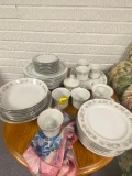 Set of Dishes with Floral Napkins