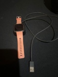 Pink FitBit Versa with Charger