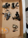 G- (5) Fishing Reels and Partial Container of Split Shot