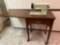 B- White Sewing Machine In Stand