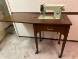 B- White Sewing Machine In Stand