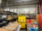 L- Shaped Green Shelving Unit (North 1/2 Wall and (1) Middle)