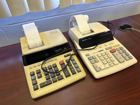 O- (2) Sharp Calculators