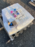 Pallet of Pink and Blue Marking Spray Cans Paint