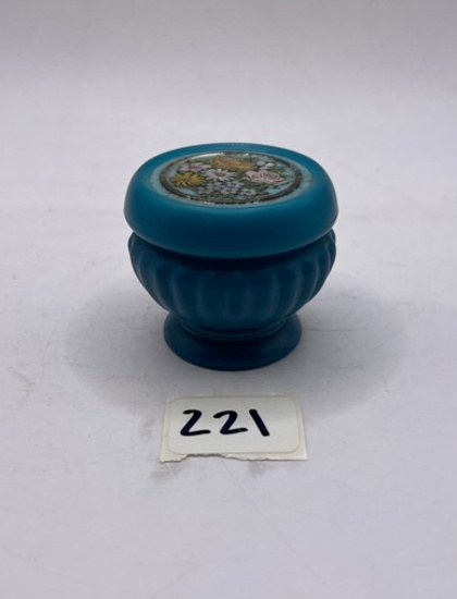 Small blue with flower top Avon bottle