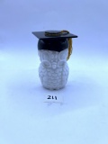 Graduation hat owl with some liquid Avon bottle