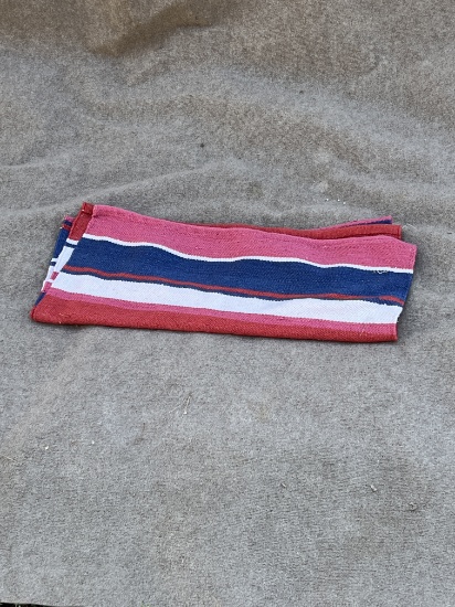 Striped red, blue and pink blanket